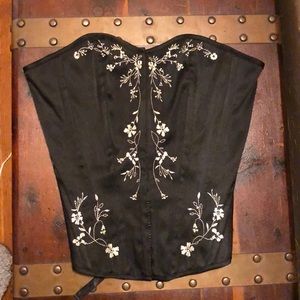 Black corset with white embroidery